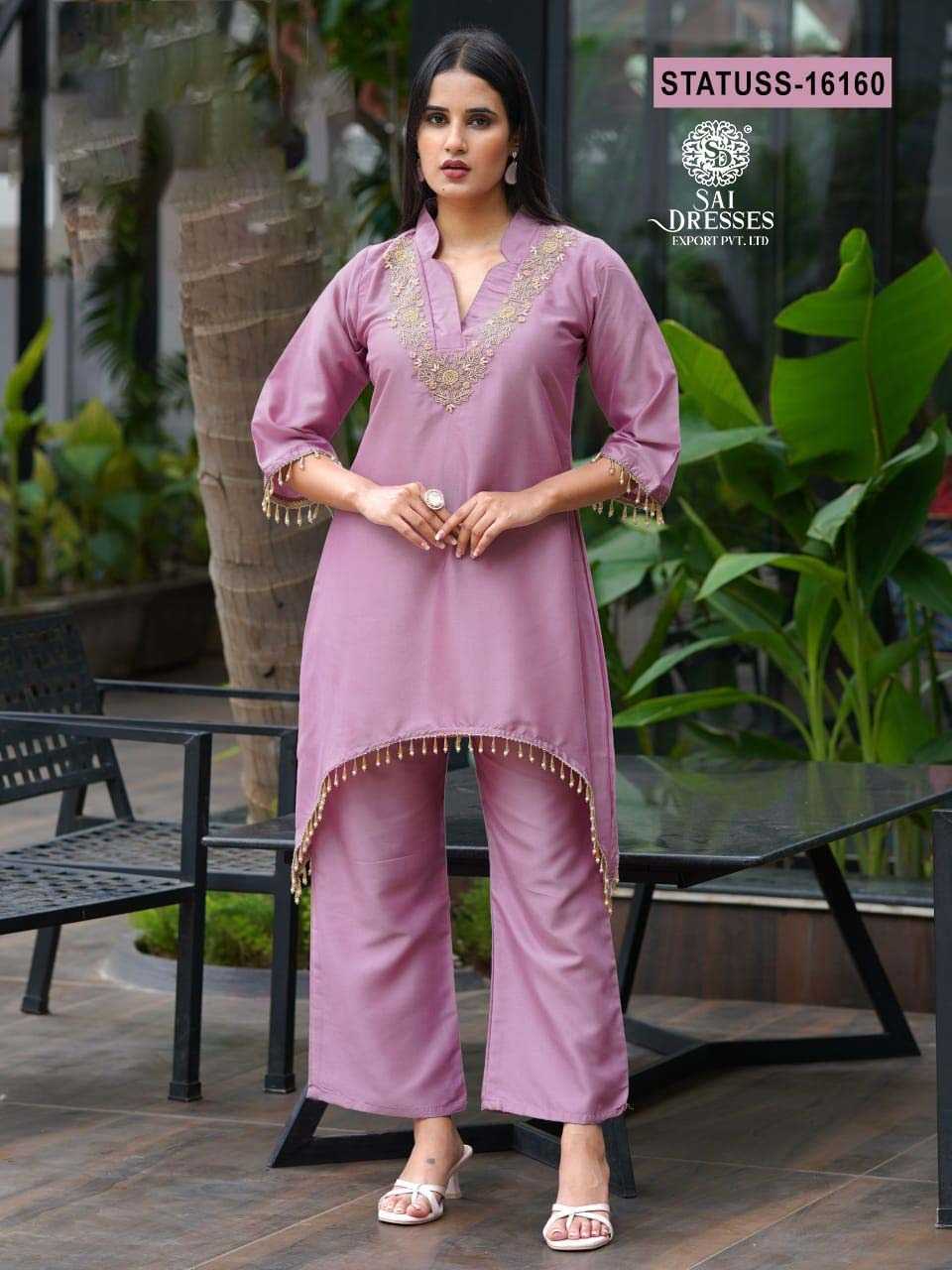 ELEGANT LAVENDER CO-ORD SET WITH HEAVY HANDWORK ON NECKLINE AND BORDERS, MADE FROM PREMIUM BOMBAY RAPIDO FABRIC FOR A CLASSY LOOK.