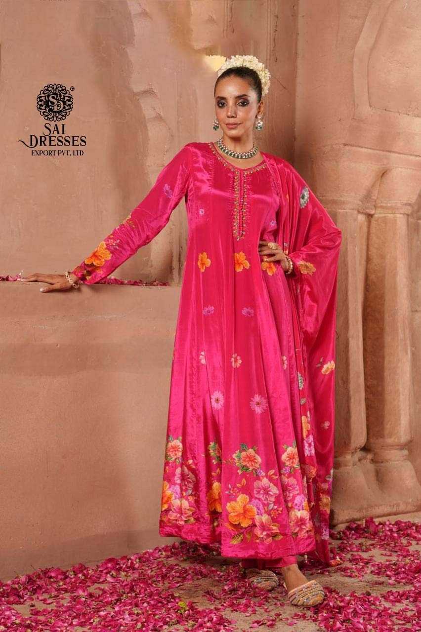 VIBRANT RANI PINK VELVET ANARKALI SUIT WITH COLORFUL FLOWER PRINTS AND DELICATE HAND EMBROIDERY – MADE FOR ROYAL OCCASIONS.