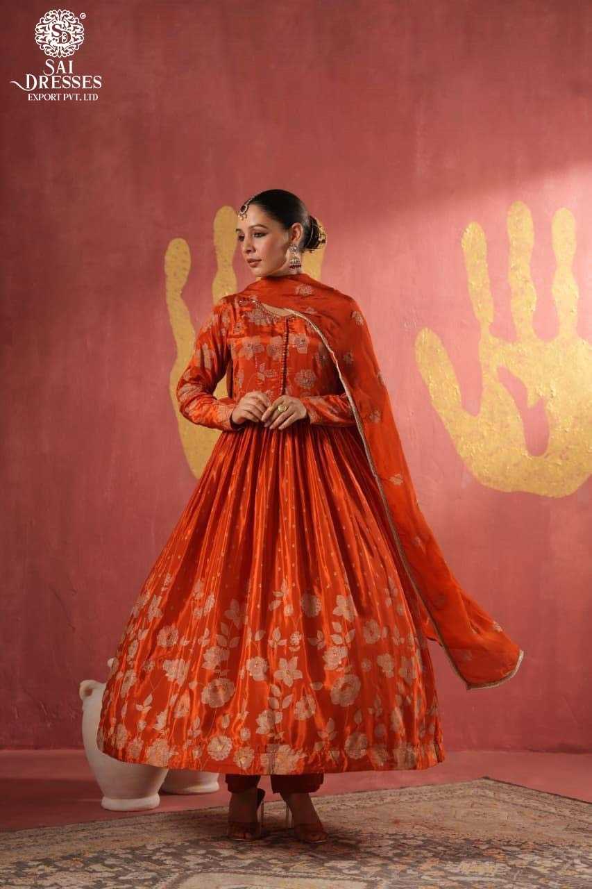 CLASSIC RUST ORANGE ANARKALI WITH INTRICATE ZARI FLORAL PATTERN AND RICH DUPATTA – DESIGNED FOR TIMELESS FESTIVE ELEGANCE.