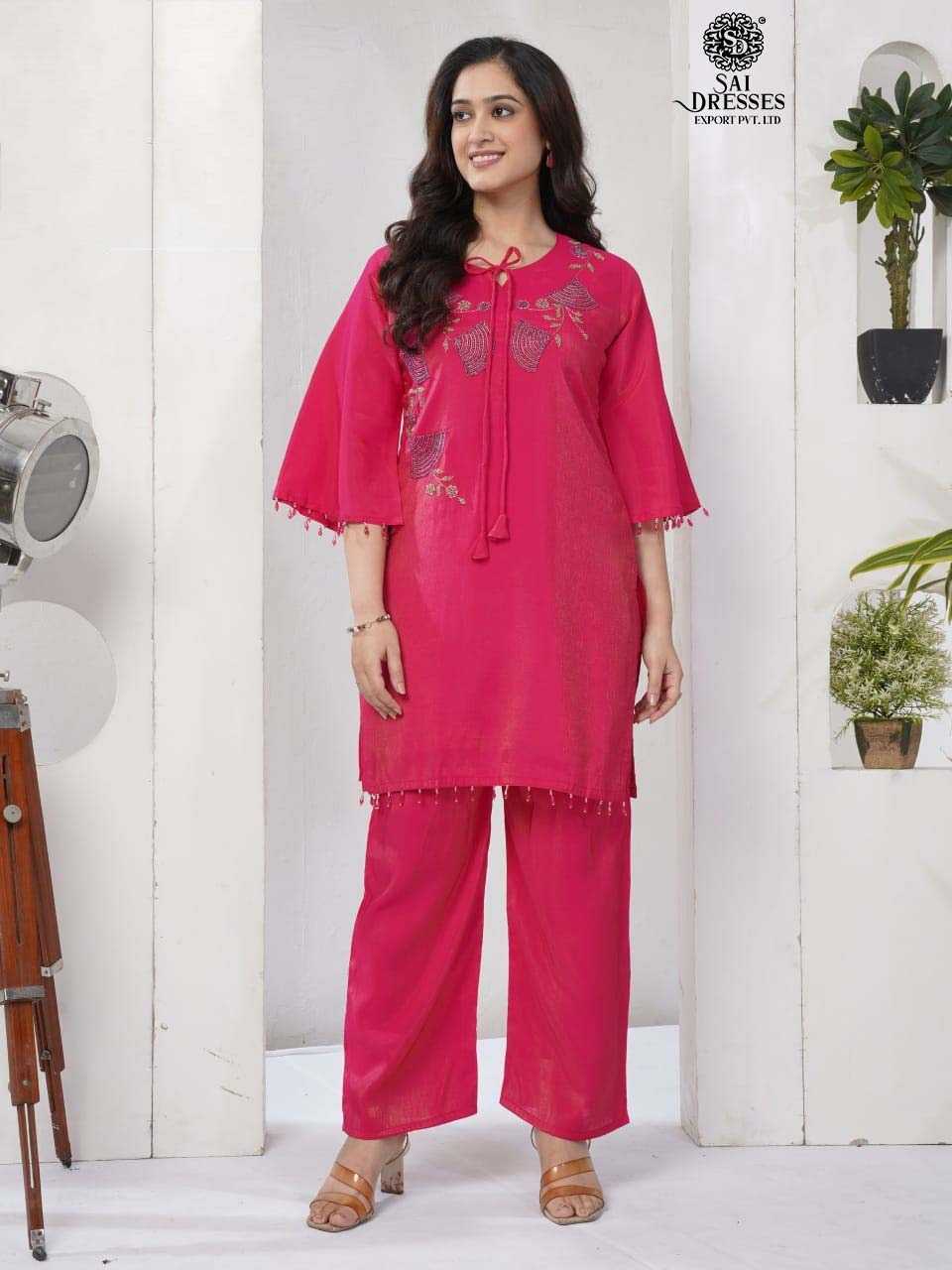 VIBRANT HOT PINK CO-ORD SET IN LUXURIOUS ROMAN SILK WITH BEAUTIFUL HANDWORK AND STYLISH TASSEL DETAILING.