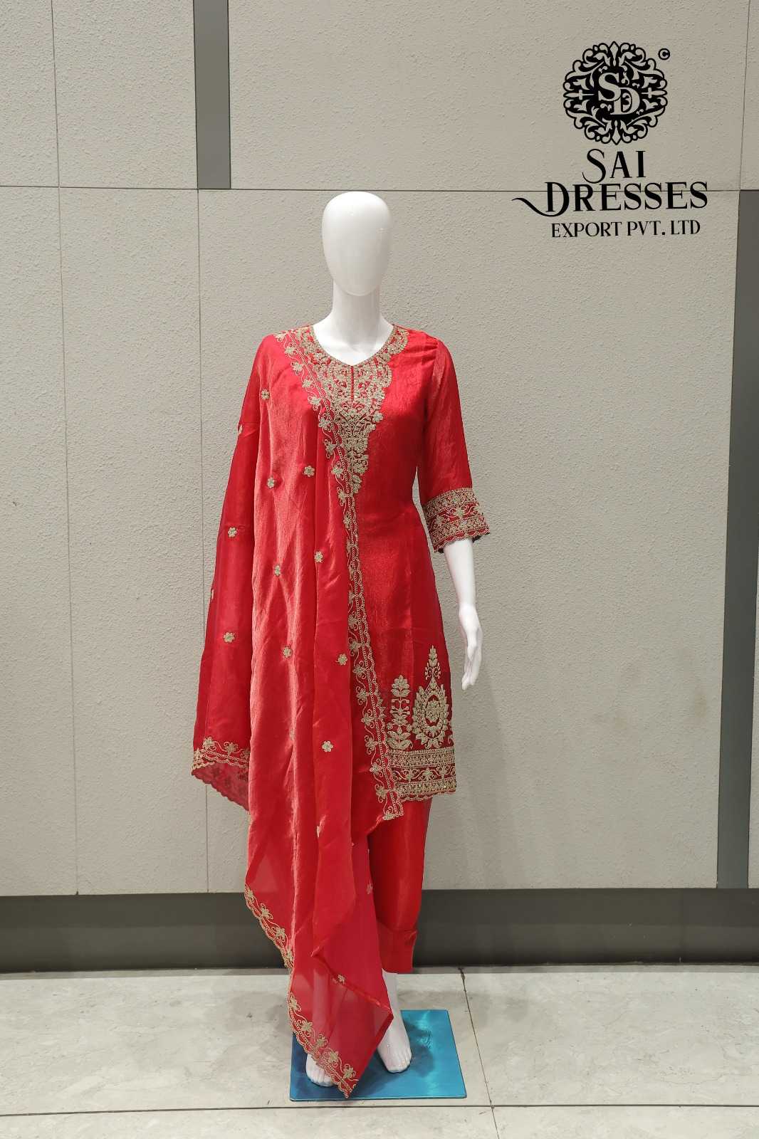 WOMEN’S FANDY FABRIC HEAVY EMBROIDERY WORK SALWAR SUIT WITH MATCHING DUPATTA IN CORAL RED